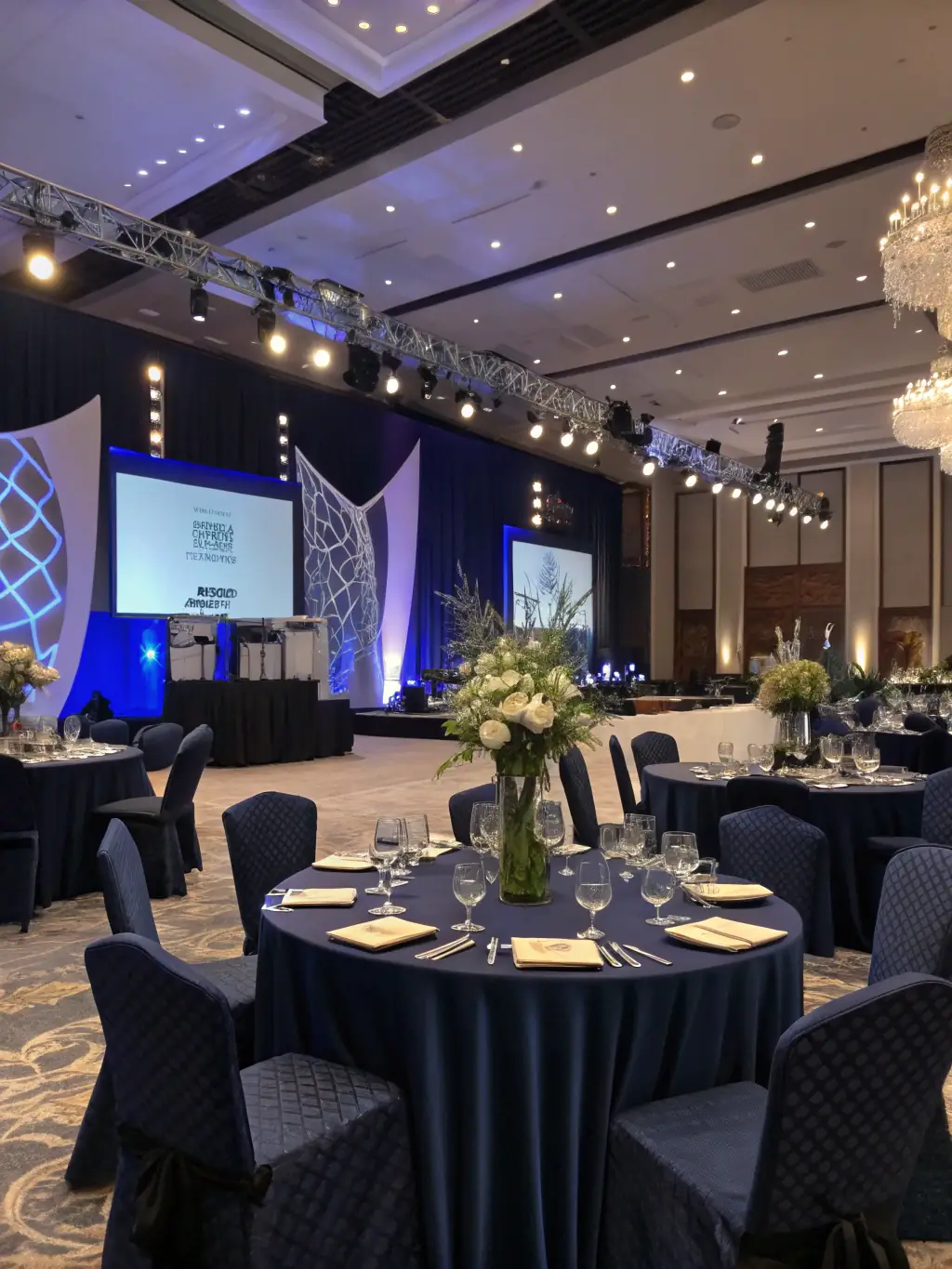 A photograph of a formal corporate gala dinner with elegantly dressed attendees, sophisticated table settings, and soft lighting, showcasing WonderRealm's expertise in high-end corporate events.